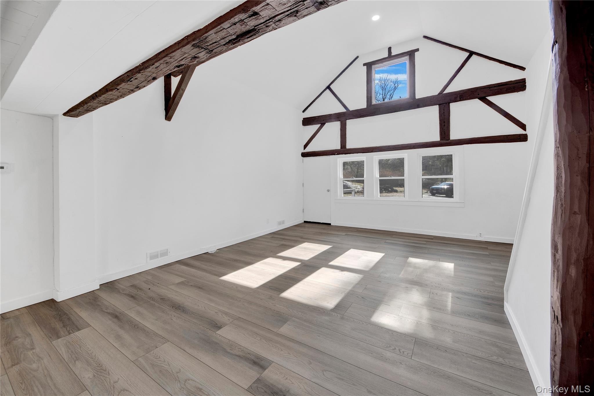 690 Gipsy Trail Road Carmel, NY 10512 - Photo 24 of 35 a view of a big room with wooden floor and windows