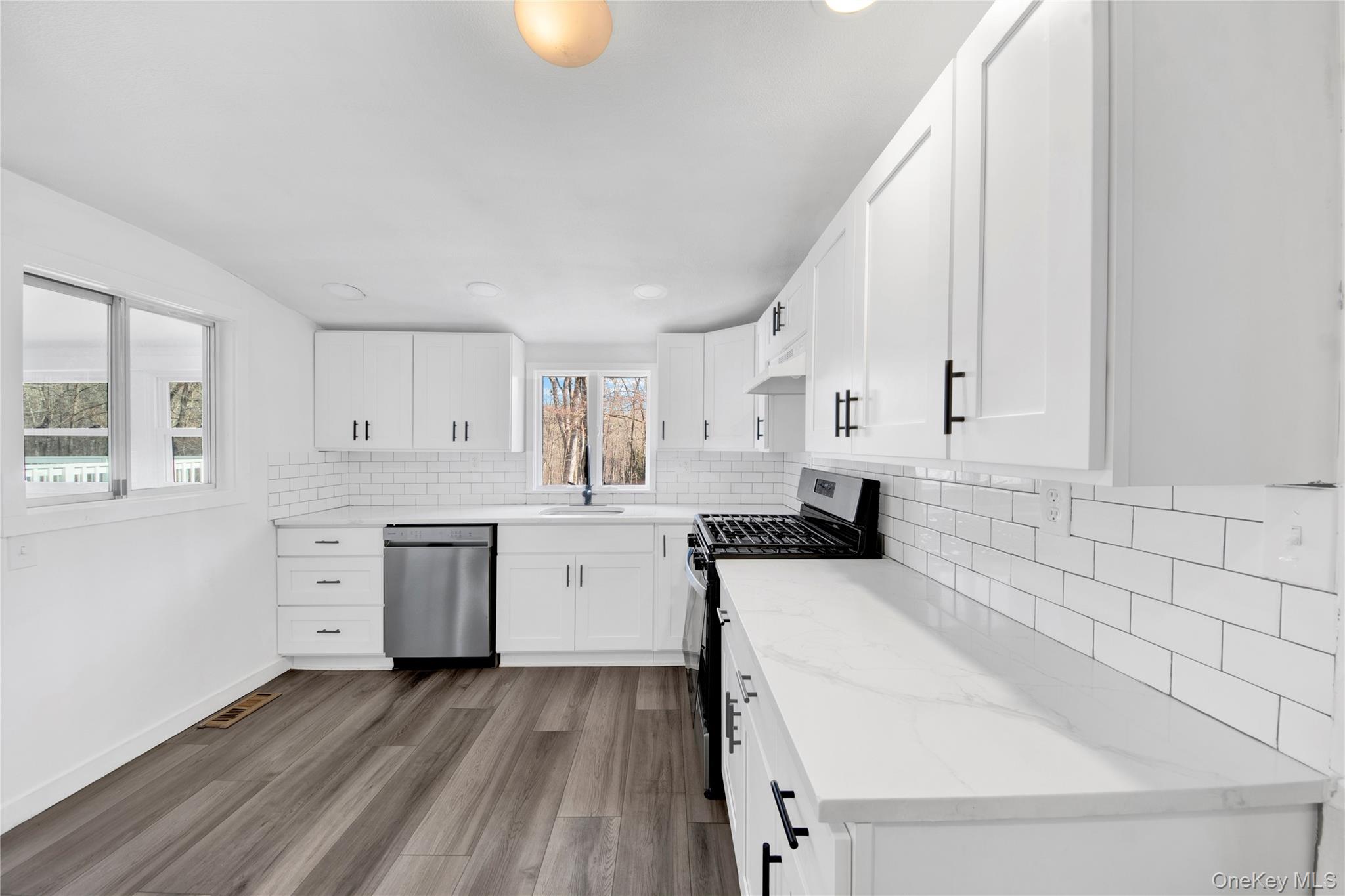 690 Gipsy Trail Road Carmel, NY 10512 - Photo 6 of 35 a kitchen with a sink a stove and cabinets