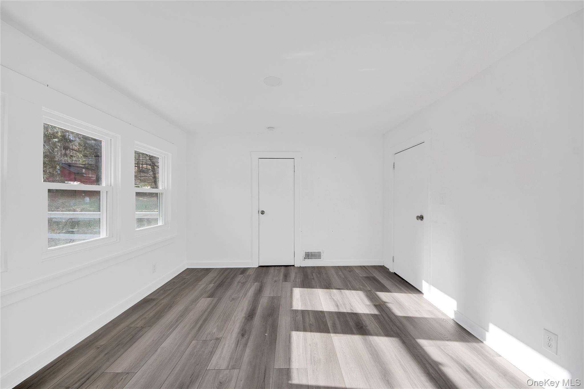 690 Gipsy Trail Road Carmel, NY 10512 - Photo 8 of 35 Empty room with wood finished floors and baseboards