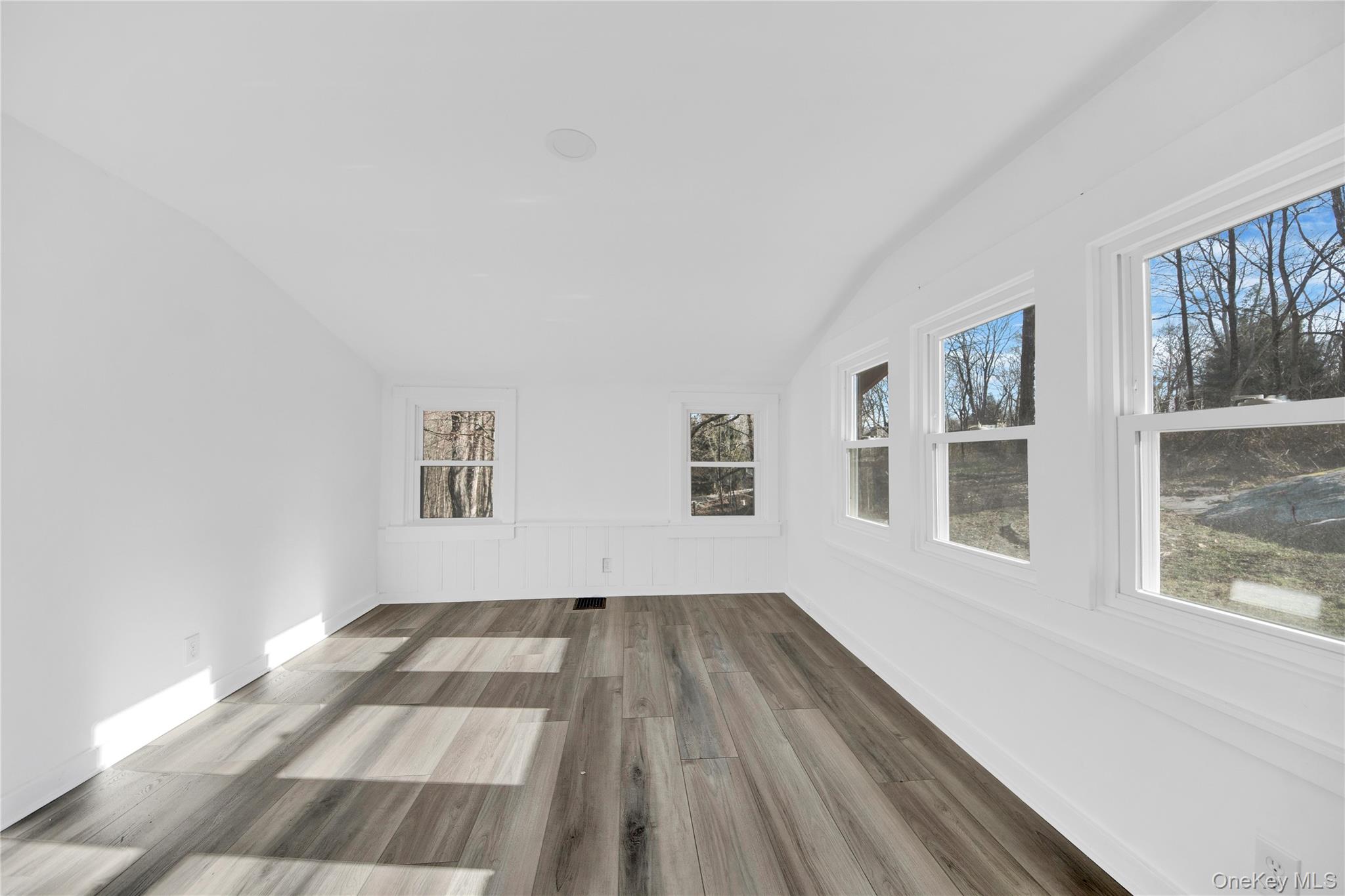 690 Gipsy Trail Road Carmel, NY 10512 - Photo 9 of 35 a view of a room with wooden floor and windows
