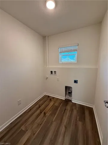 a room with a wooden floor and a sink