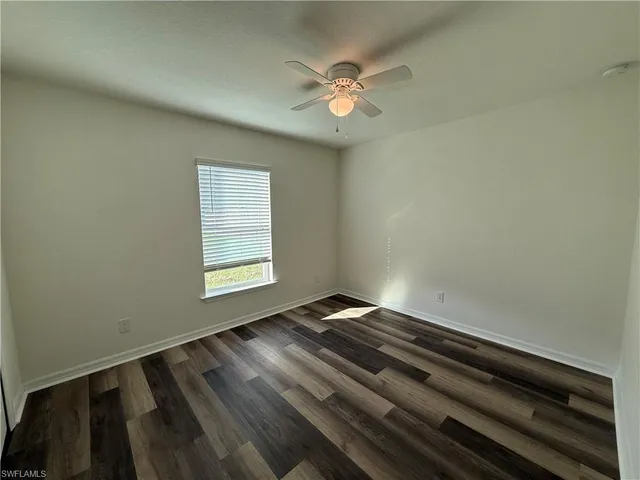 a view of an empty room and window