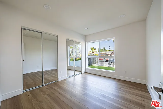 a room with window and wooden floor