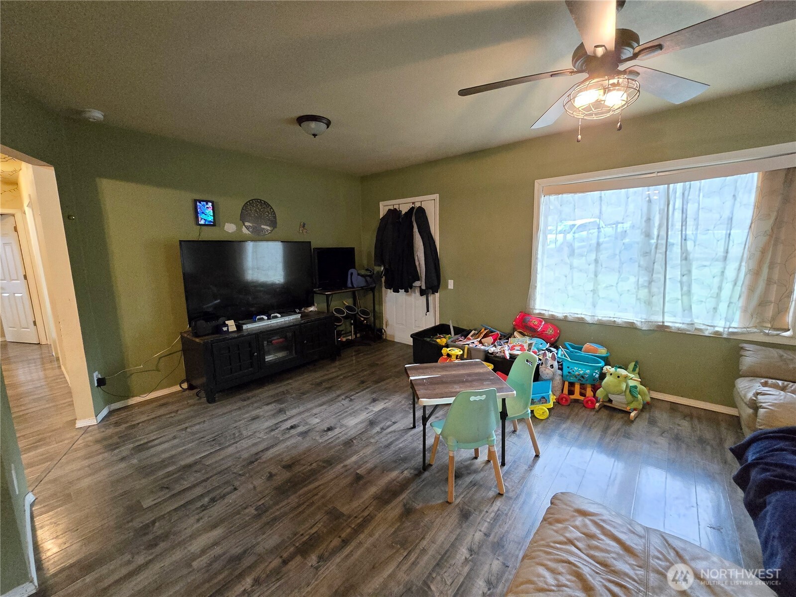 276261 Highway 101 Sequim, WA 98382 - Photo 13 of 33 a living room with furniture and a flat screen tv