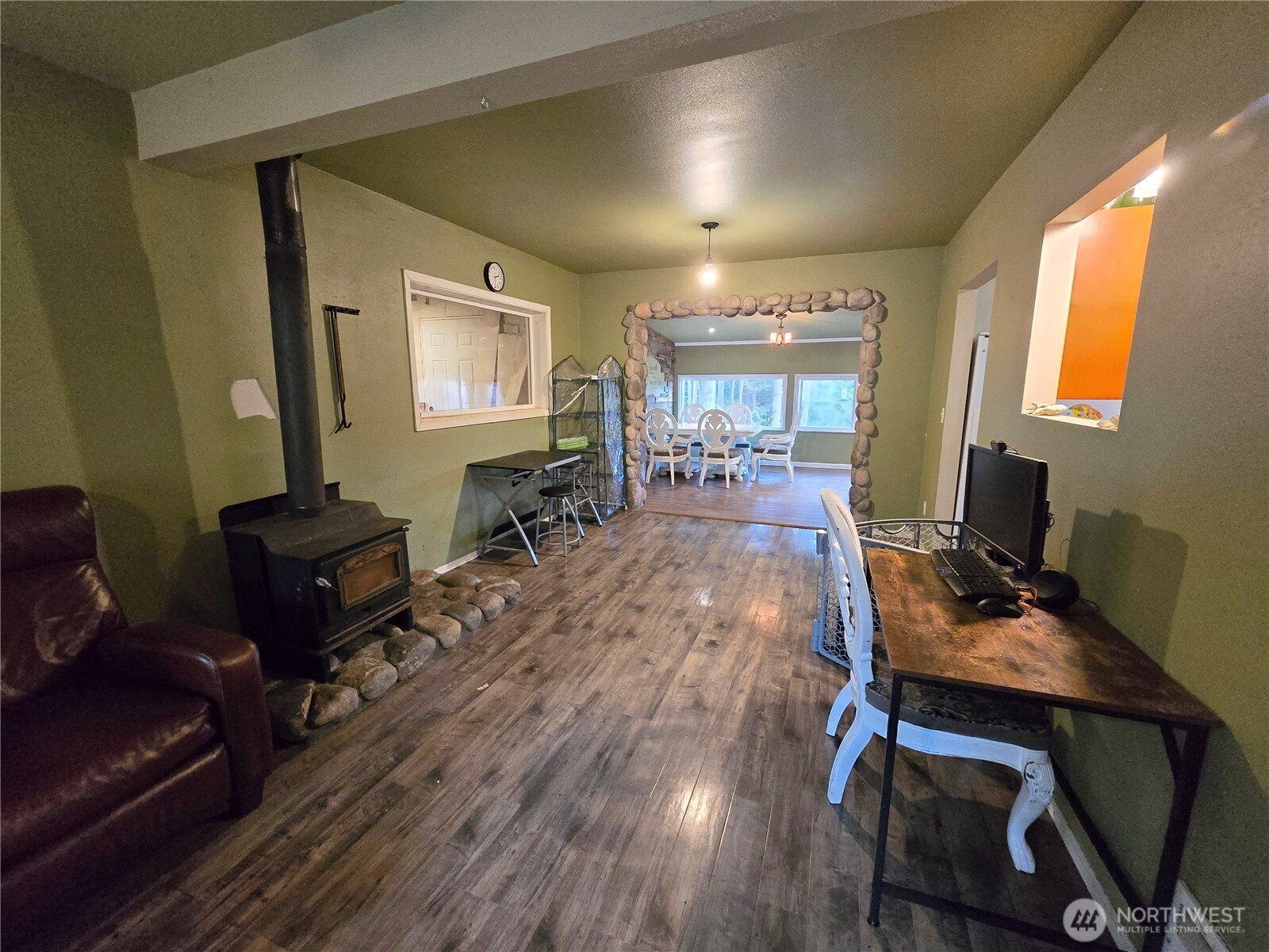 276261 Highway 101 Sequim, WA 98382 - Photo 14 of 33 a room with wooden floor and glass windows