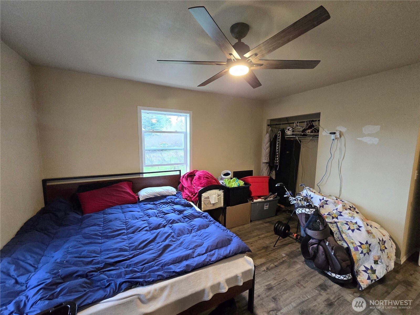 276261 Highway 101 Sequim, WA 98382 - Photo 19 of 33 a bedroom with furniture and a chandelier