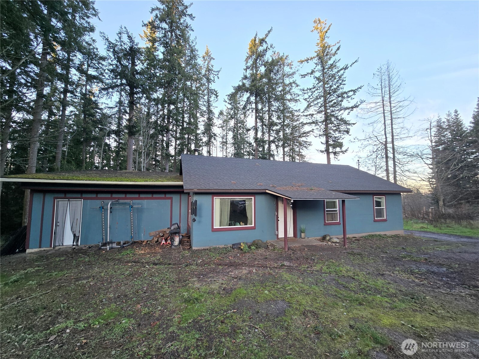 276261 Highway 101 Sequim, WA 98382 - Photo 2 of 33 a house that has a tree in front of it