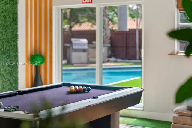 a room with furniture and a potted plant