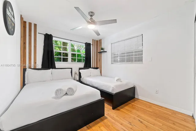 a en suite bathroom with a tub sink and mirror
