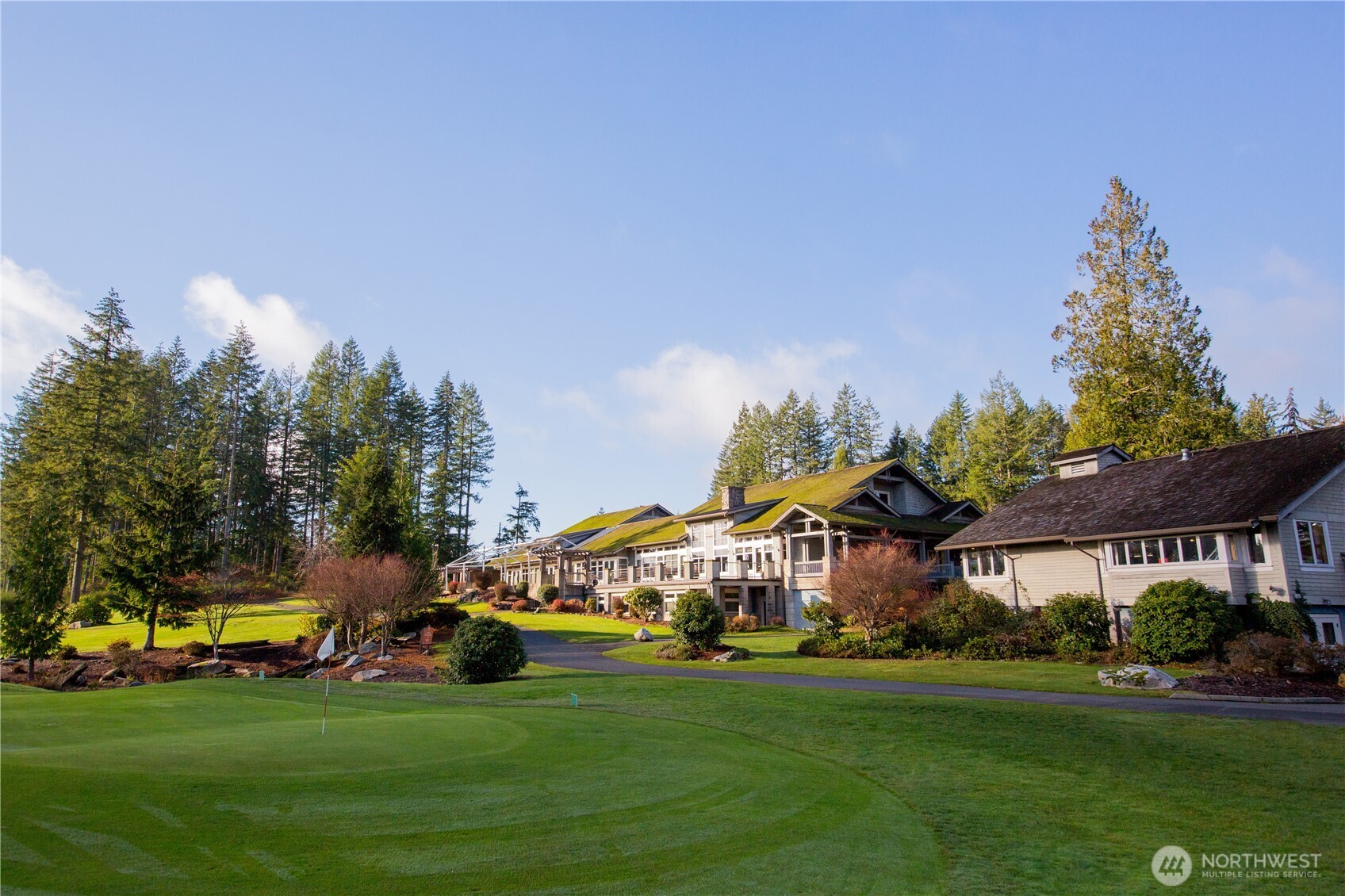 6094 Trce Drive Southwest Port Orchard, WA 98367 - Photo 27 of 33 a view of a big house with garden and parking space