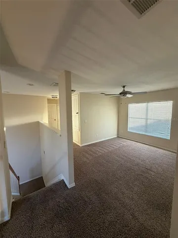 a view of empty room with windows