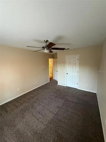 an empty room with a empty space and windows