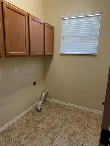 a view of a room with wooden floor and cabinet