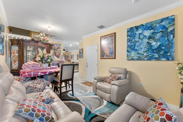 a bed room with a bed and a painting on the wall