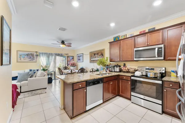 a living room with furniture and dining area