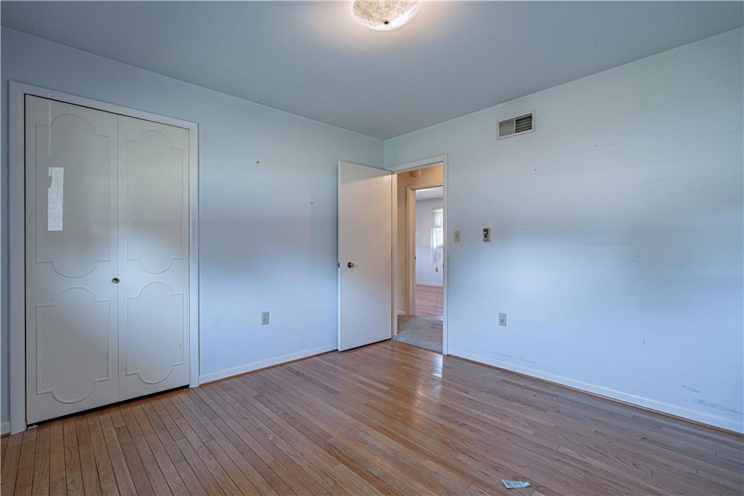 4815 Mill Road Schnecksville, PA 18078 - Photo 27 of 48 Hardwood floors and a spacious closet create a clean, inviting bedroom.