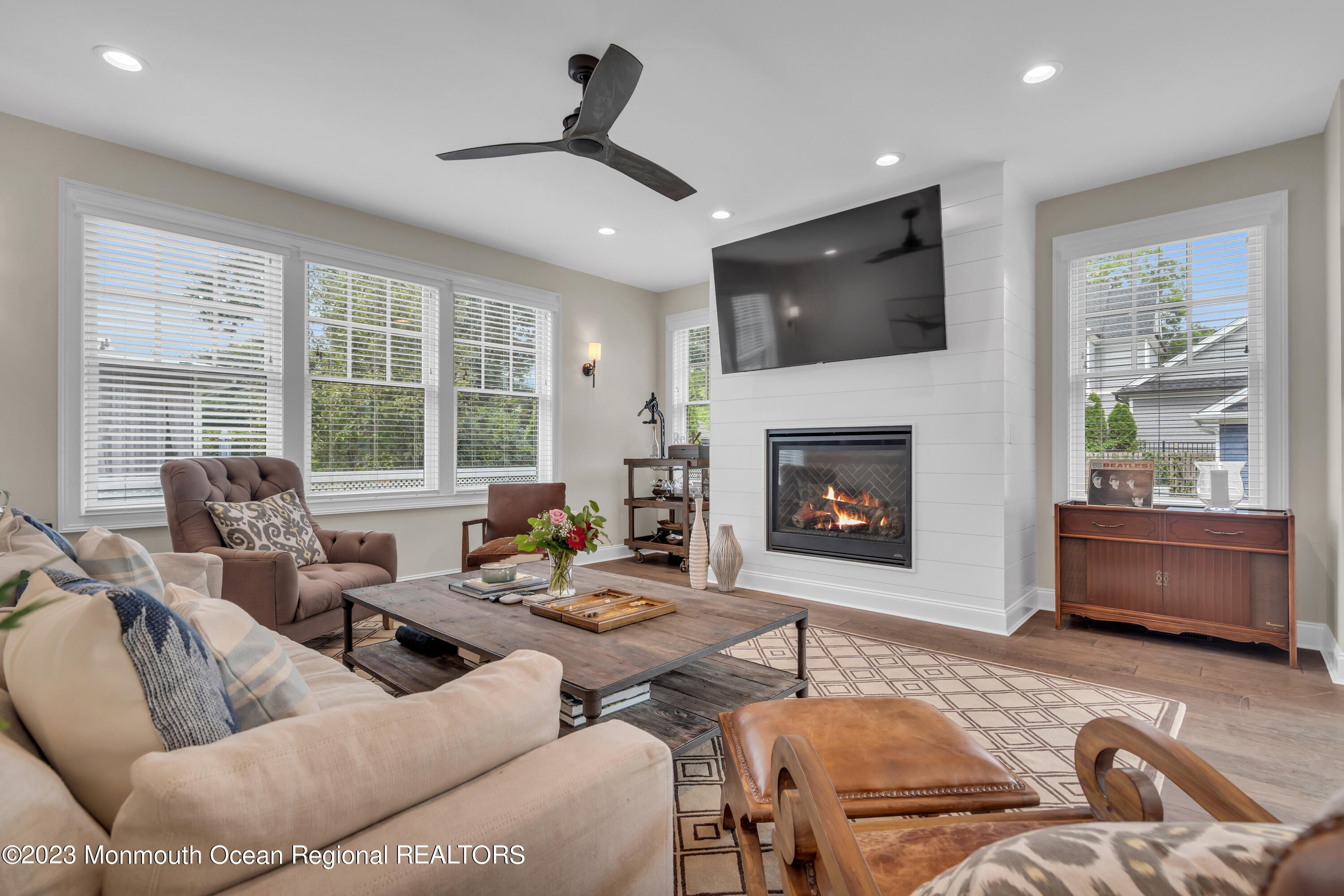 2118 Edgewood Place, Unit JULY Spring Lake, NJ 07762 - Photo 19 of 61 a living room with furniture fireplace and flat screen tv