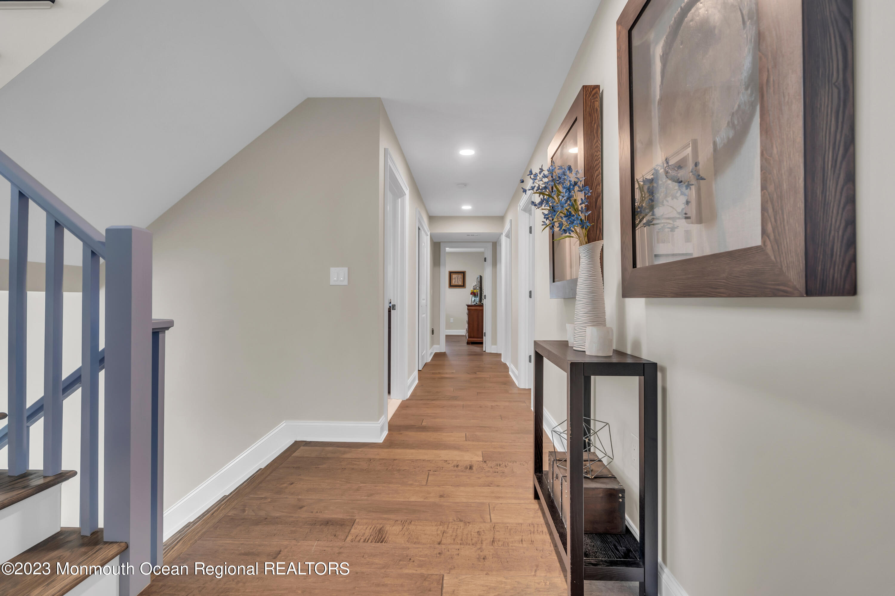2118 Edgewood Place, Unit JULY Spring Lake, NJ 07762 - Photo 24 of 61 a view of a hallway with wooden floor and staircase