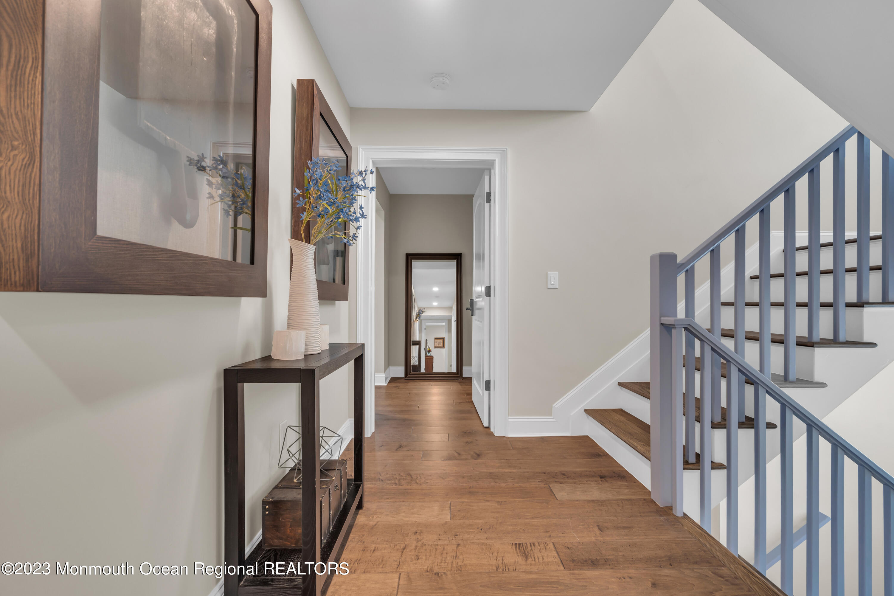 2118 Edgewood Place, Unit JULY Spring Lake, NJ 07762 - Photo 26 of 61 a view of a hallway with wooden floor and staircase