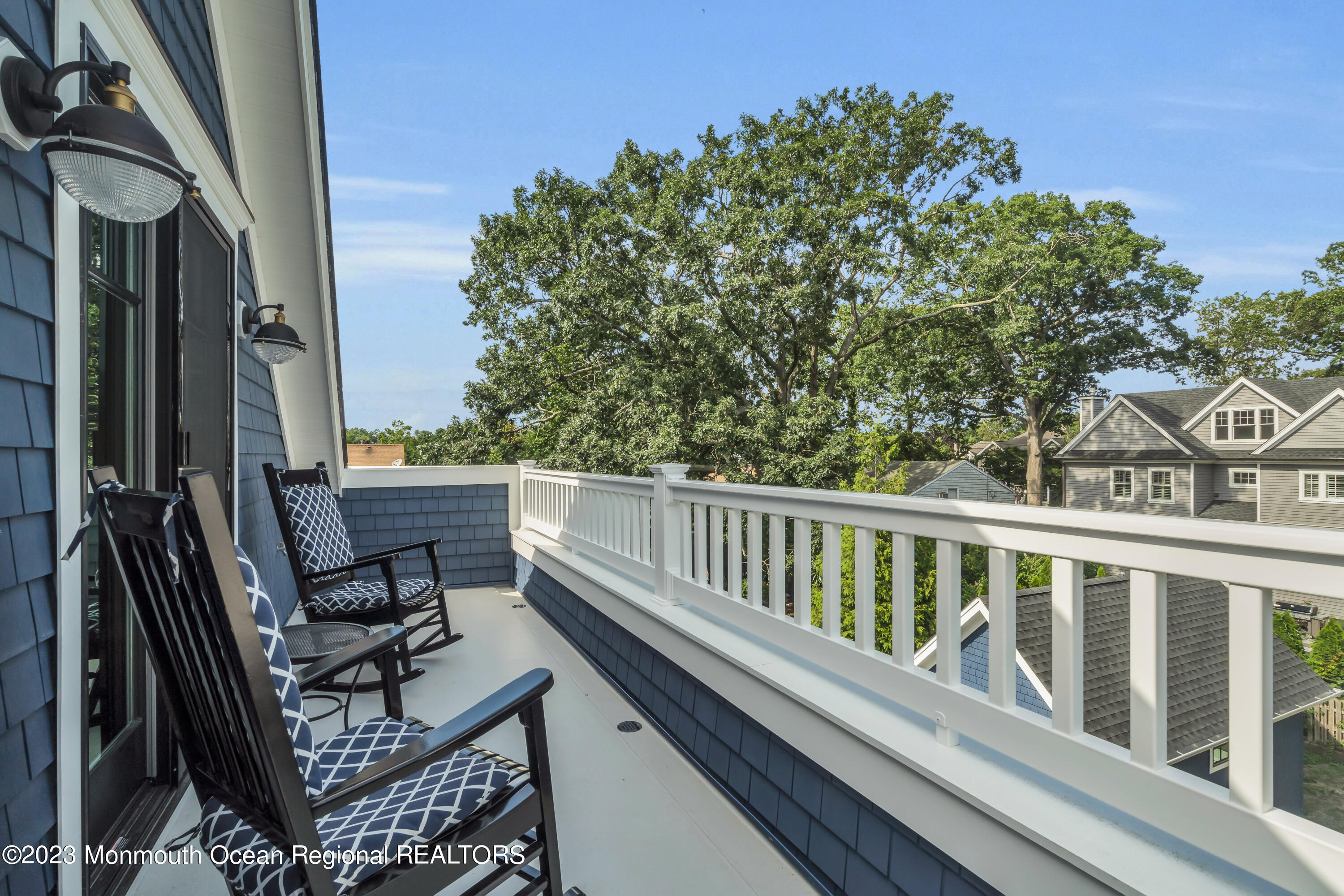 2118 Edgewood Place, Unit JULY Spring Lake, NJ 07762 - Photo 48 of 61 a view of balcony with wooden floor and fence