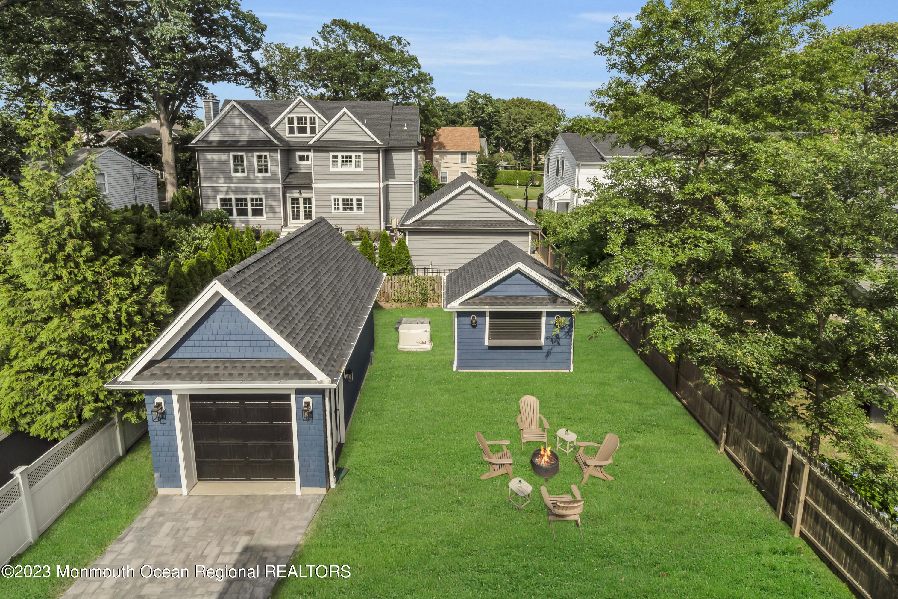2118 Edgewood Place, Unit JULY Spring Lake, NJ 07762 - Photo 55 of 61 a front view of a house with a garden and yard