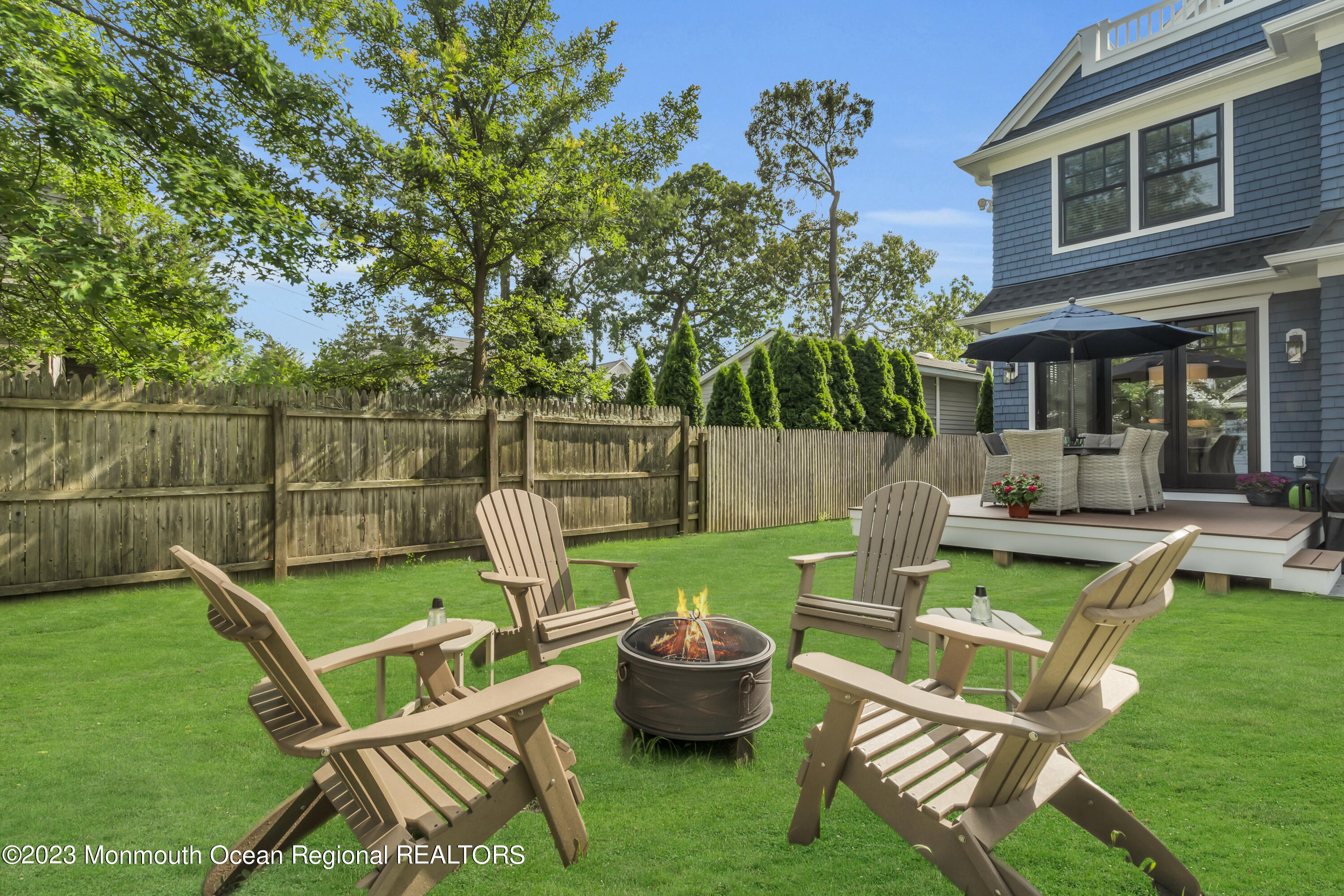 2118 Edgewood Place, Unit JULY Spring Lake, NJ 07762 - Photo 59 of 61 a view of a backyard with couches chair and tables