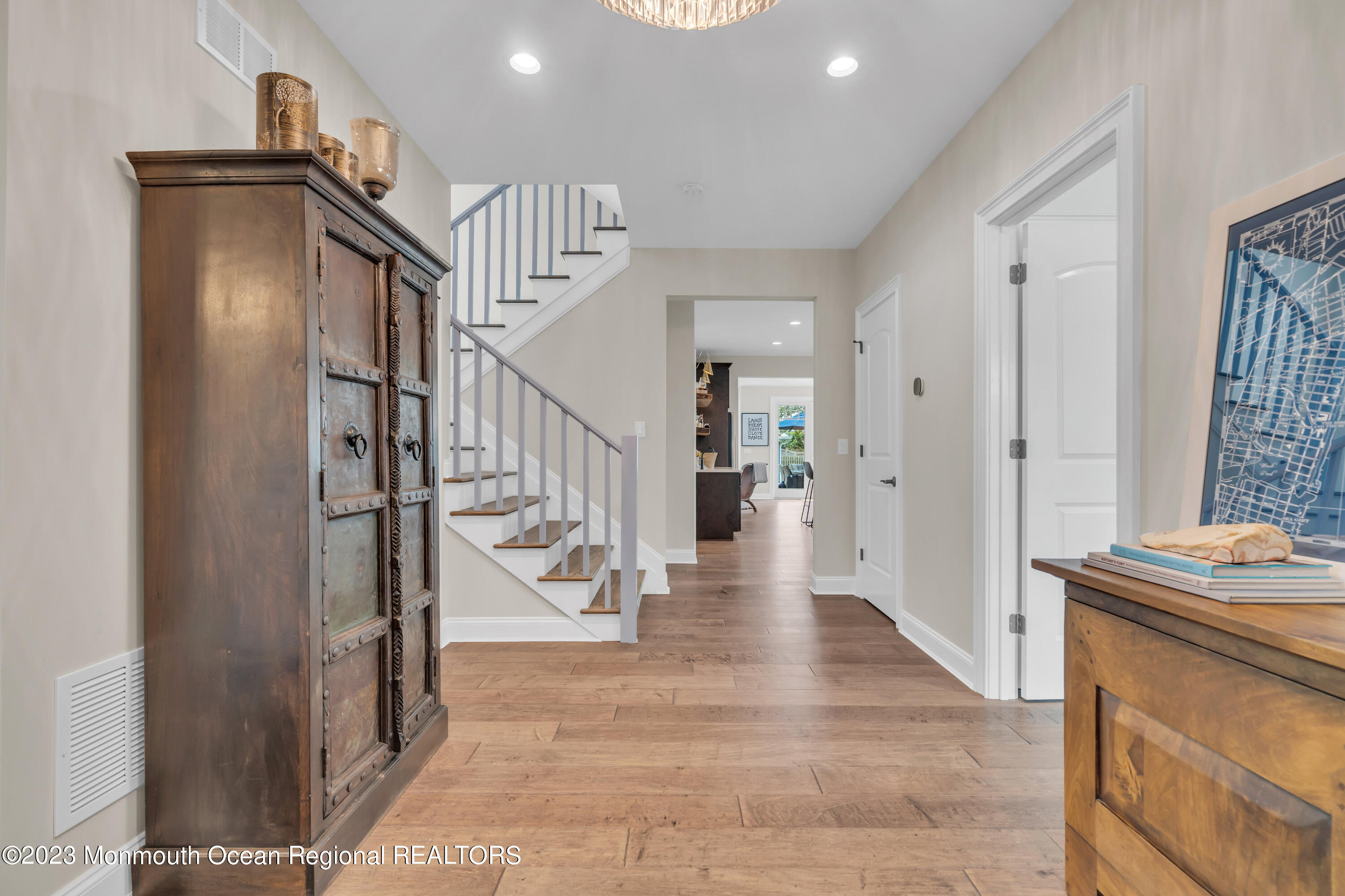 2118 Edgewood Place, Unit JULY Spring Lake, NJ 07762 - Photo 6 of 61 a view of a hallway with wooden floor and staircase
