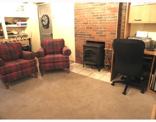 1174 Prospect Road Whitehall, PA 15227 - Photo 6 of 8 Den/Family/Great Room. Wood Burning Stove, New Bath off Family room, direct access to outside from lower level.