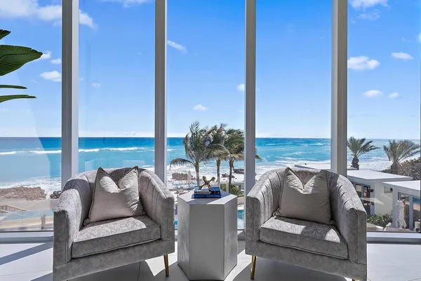 a living room with furniture and outdoor view