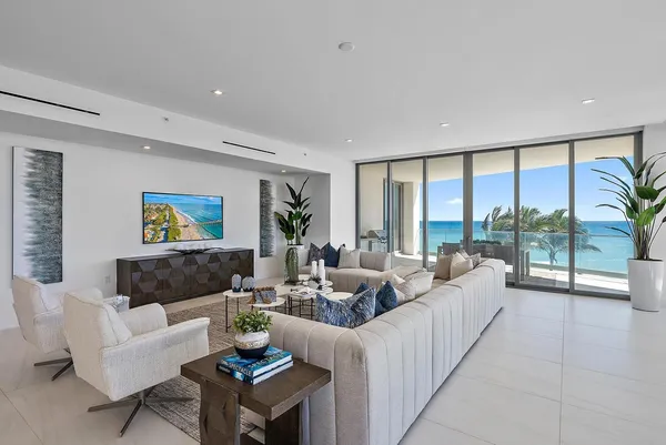 a living room with furniture and a large window