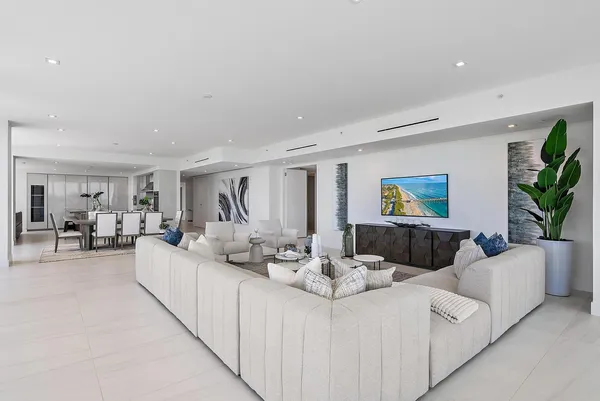 a living room with furniture and a table