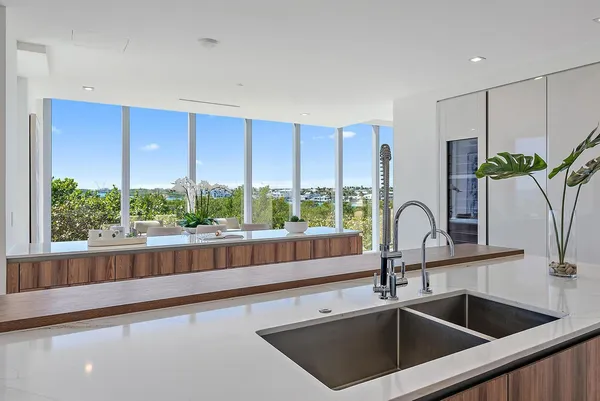 a view kitchen with a sink and large window