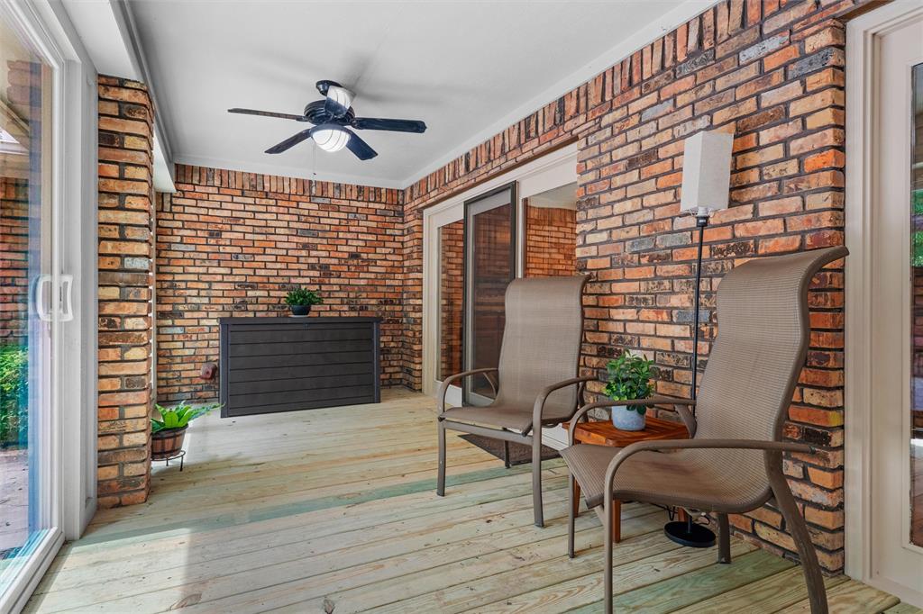 217 Valley Ranch Road Weatherford, TX 76087 - Photo 31 of 38 Covered outdoor patio featuring brick walls and light wood-finish flooring