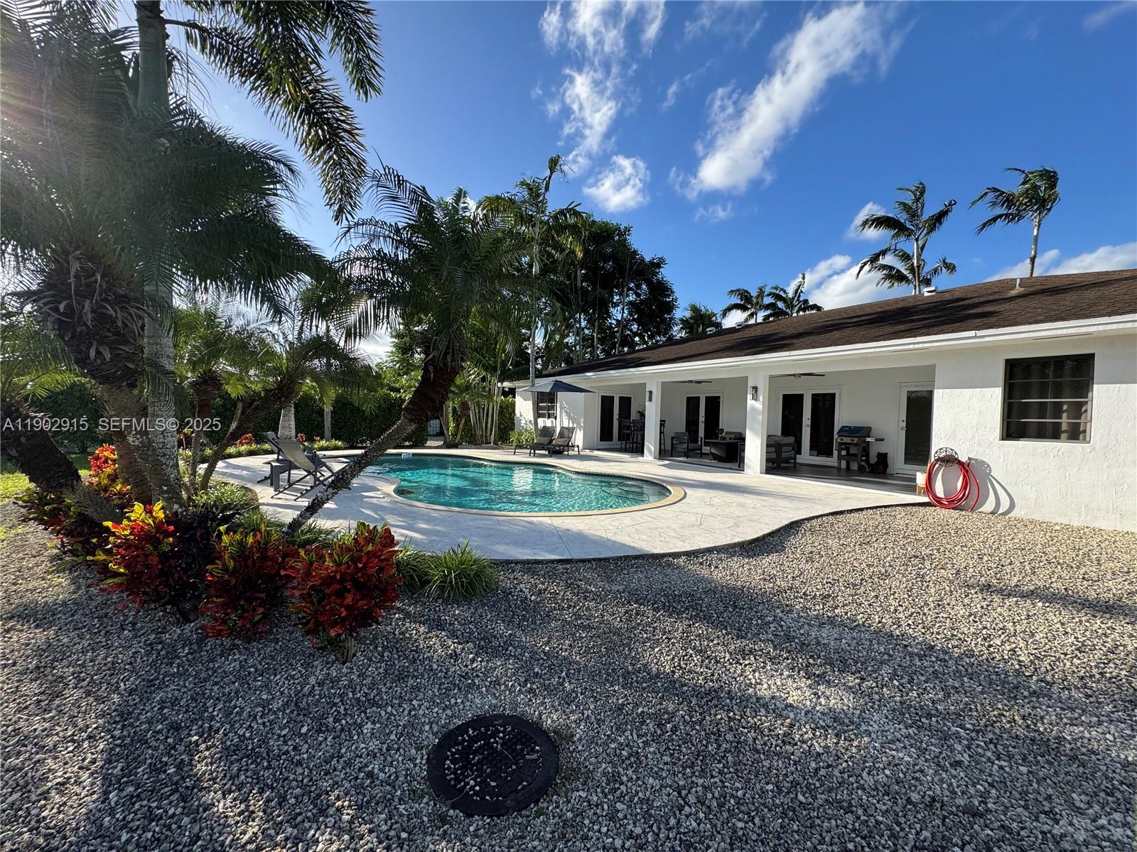 20440 Southwest 292nd Street Homestead, FL 33030 - Photo 14 of 57 a view of a house with backyard and sitting area