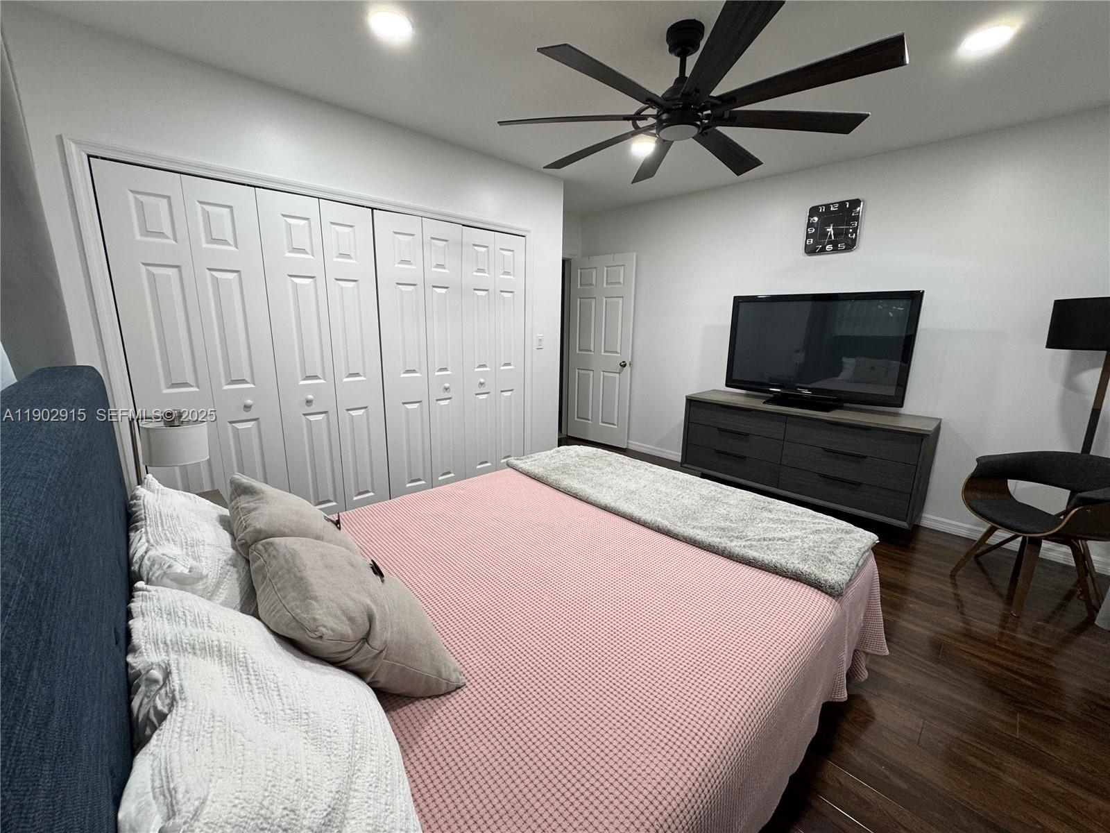 20440 Southwest 292nd Street Homestead, FL 33030 - Photo 25 of 57 a bedroom with a bed and a flat screen tv
