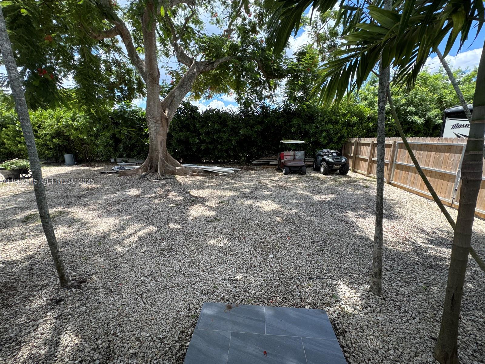 20440 Southwest 292nd Street Homestead, FL 33030 - Photo 35 of 57 a view of a backyard with a tree