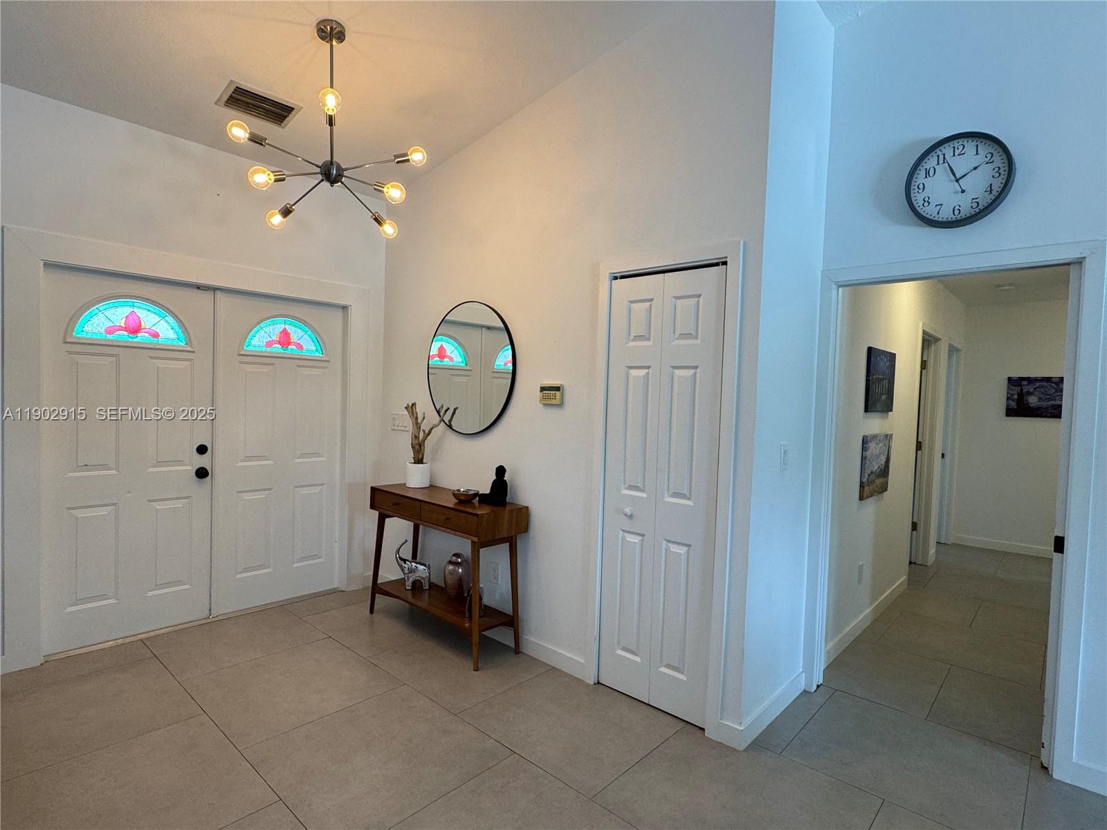 20440 Southwest 292nd Street Homestead, FL 33030 - Photo 36 of 57 a view of a hallway to a livingroom with furniture