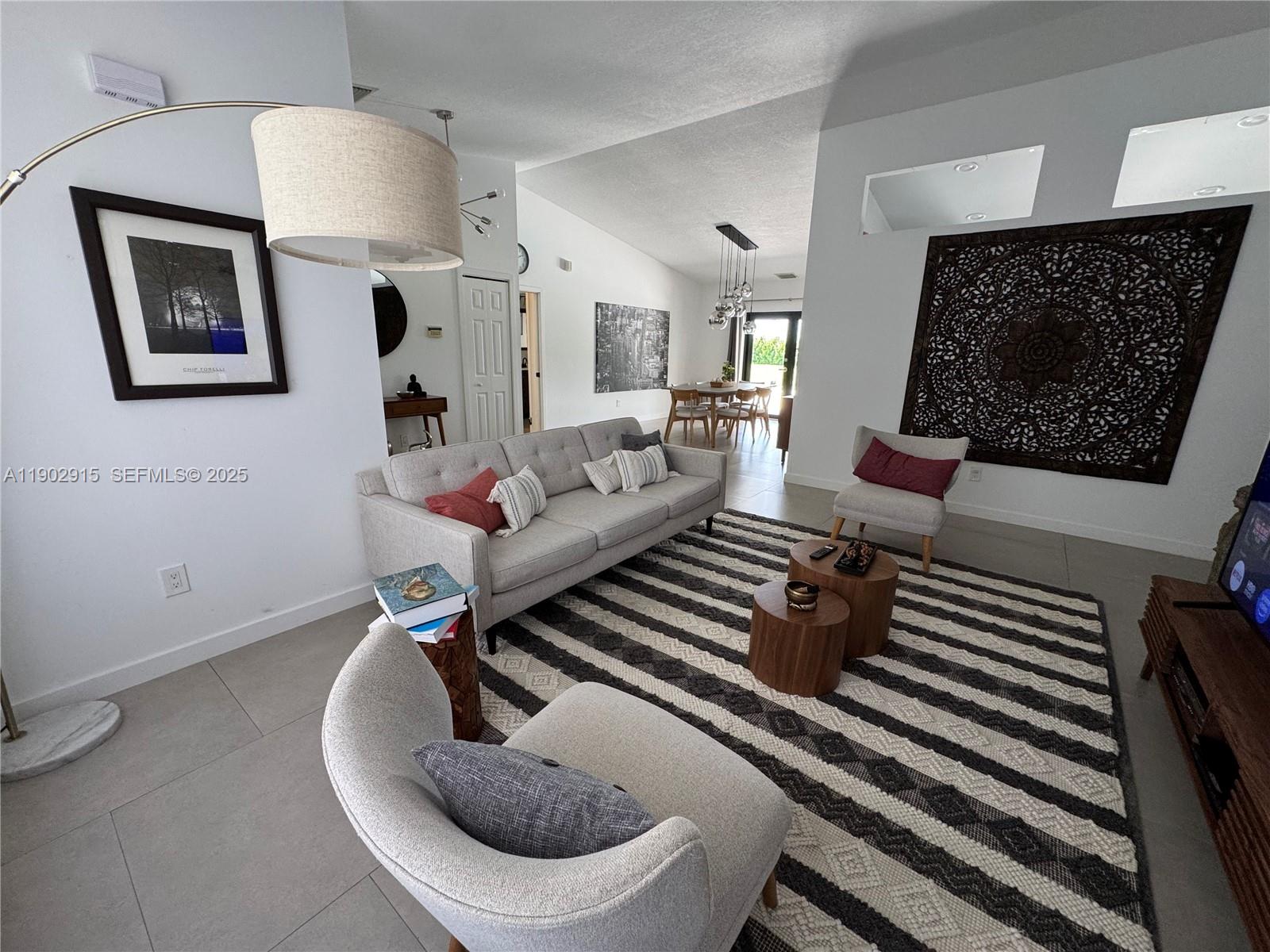 20440 Southwest 292nd Street Homestead, FL 33030 - Photo 44 of 57 a living room with furniture and a wooden floor