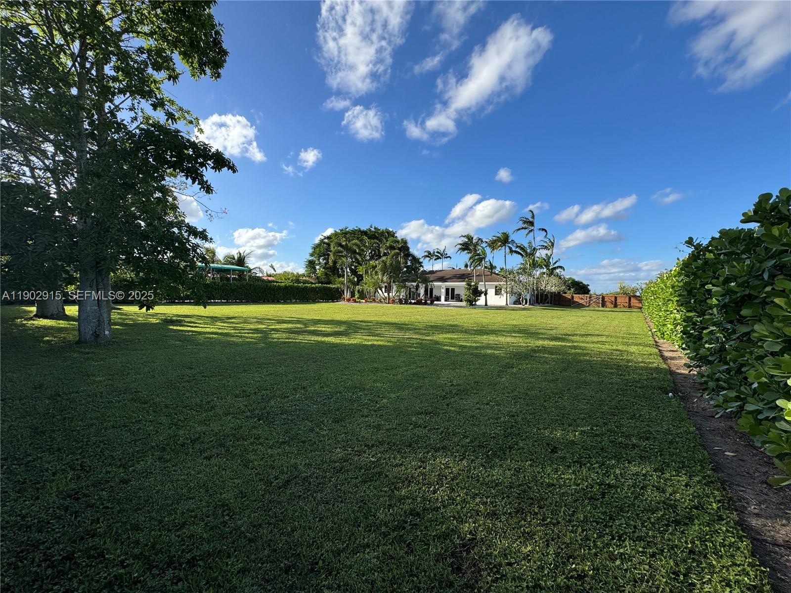 20440 Southwest 292nd Street Homestead, FL 33030 - Photo 7 of 57 a view of a golf course with a big yard