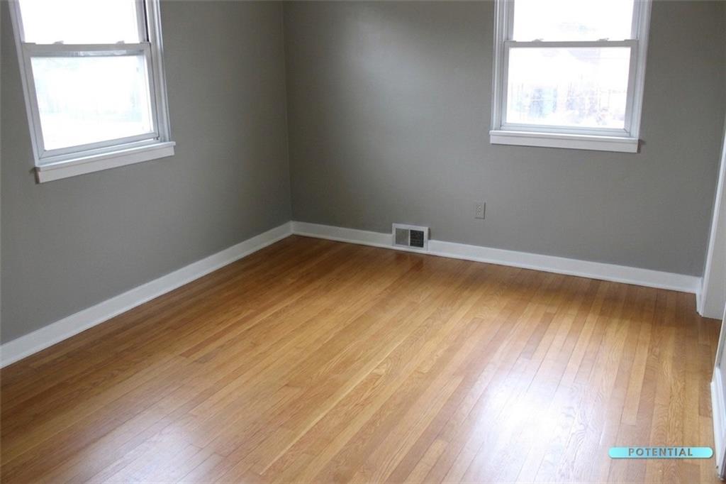 825 Liberty Street Duquesne, PA 15110 - Photo 24 of 25 an empty room with wooden floor and windows