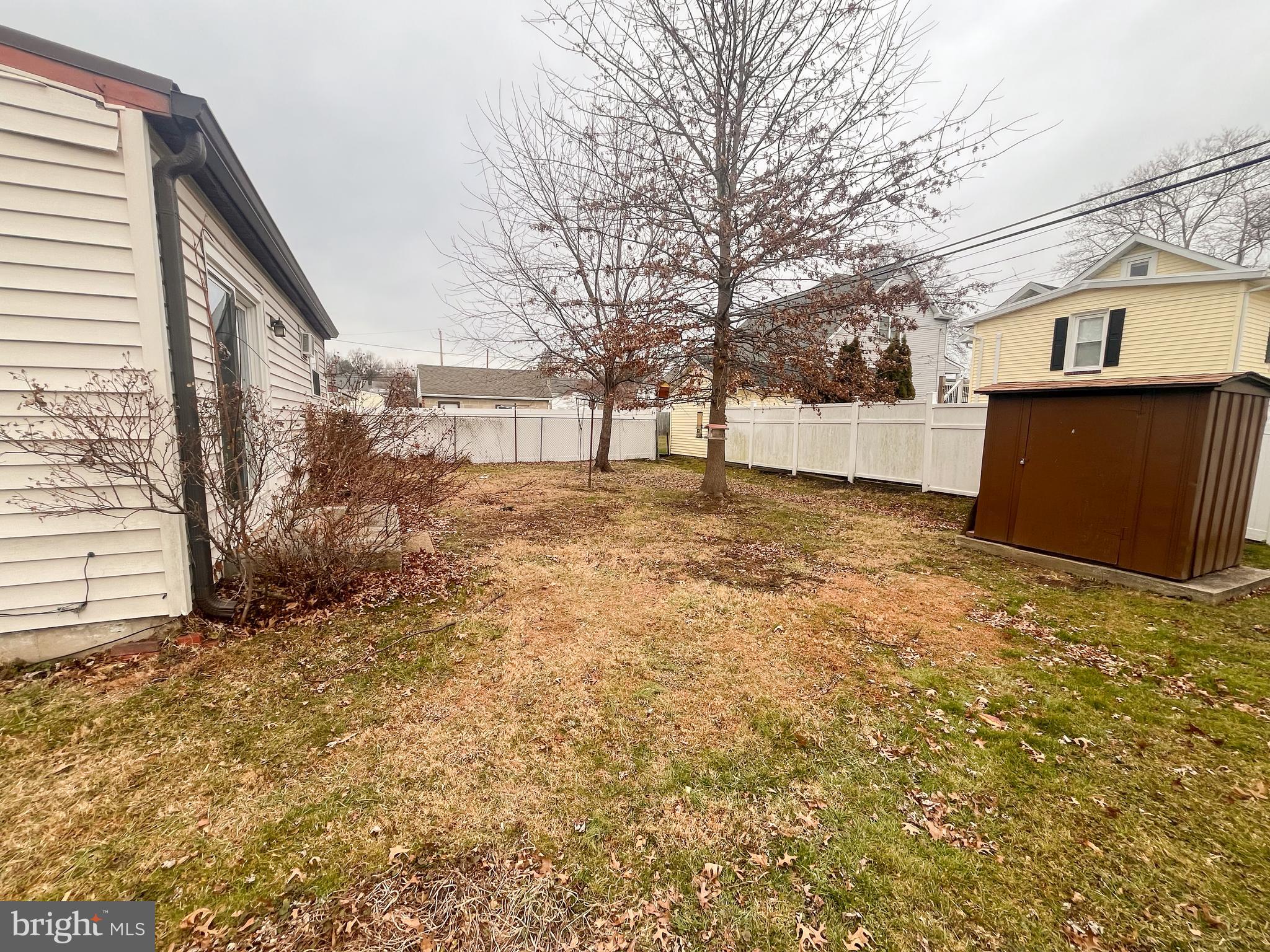 105 Harding Avenue Wilmington, DE 19804 - Photo 12 of 16 a view of a yard with a large tree