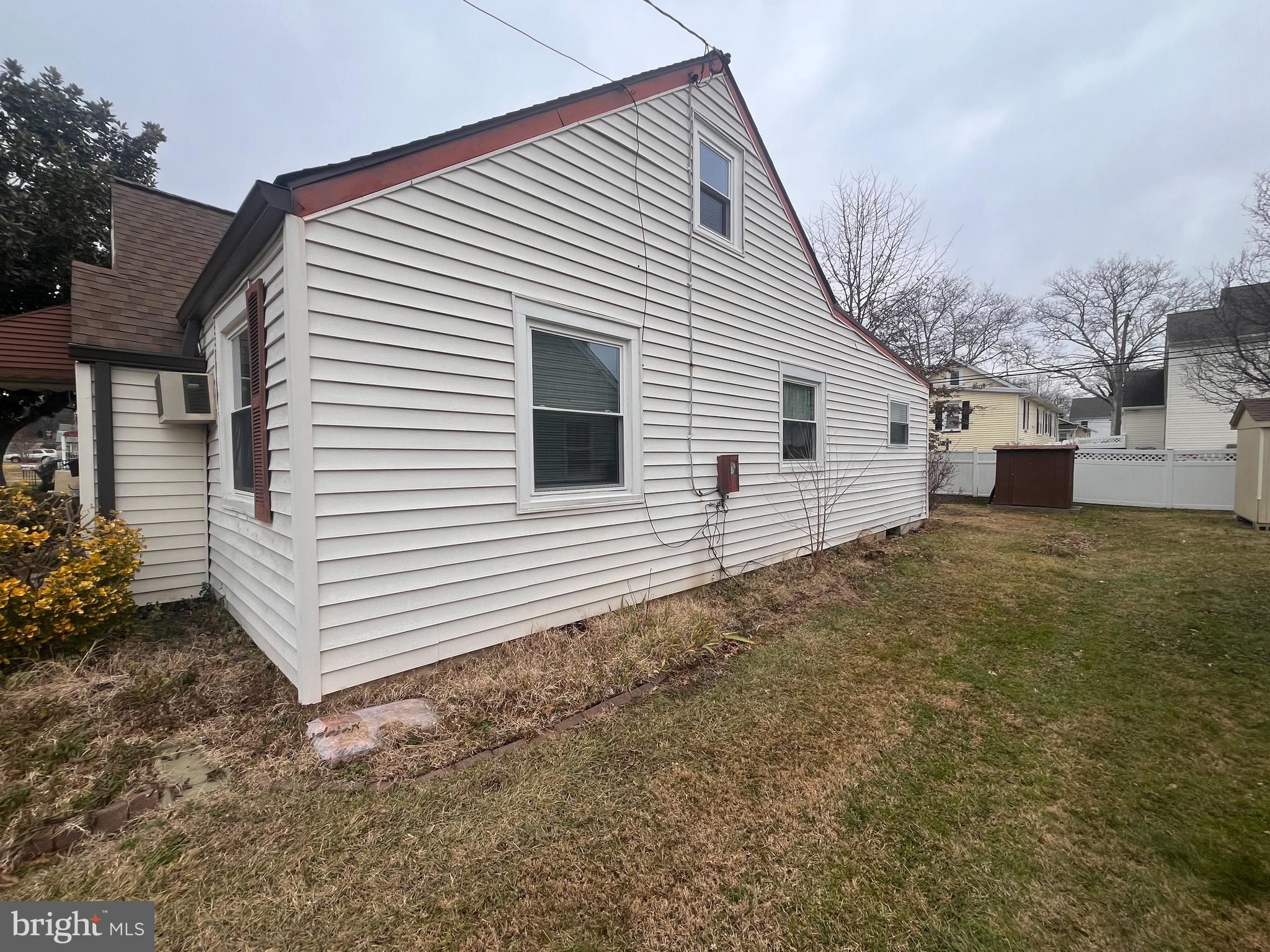105 Harding Avenue Wilmington, DE 19804 - Photo 15 of 16 a view of a white house with a yard and garage