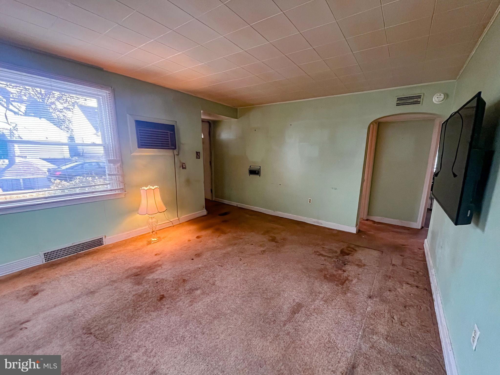 105 Harding Avenue Wilmington, DE 19804 - Photo 3 of 16 a view of a livingroom with wooden floor and a window