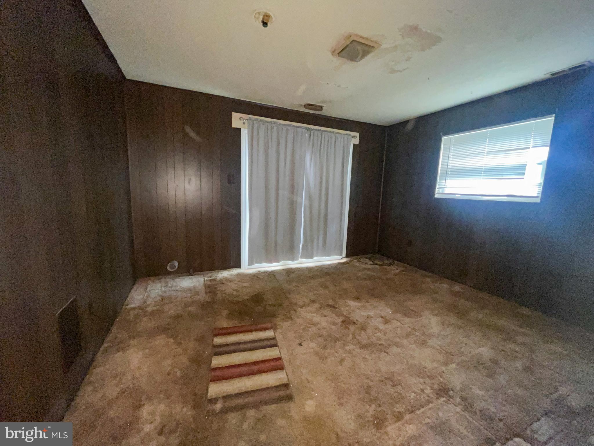 105 Harding Avenue Wilmington, DE 19804 - Photo 6 of 16 an empty room with windows