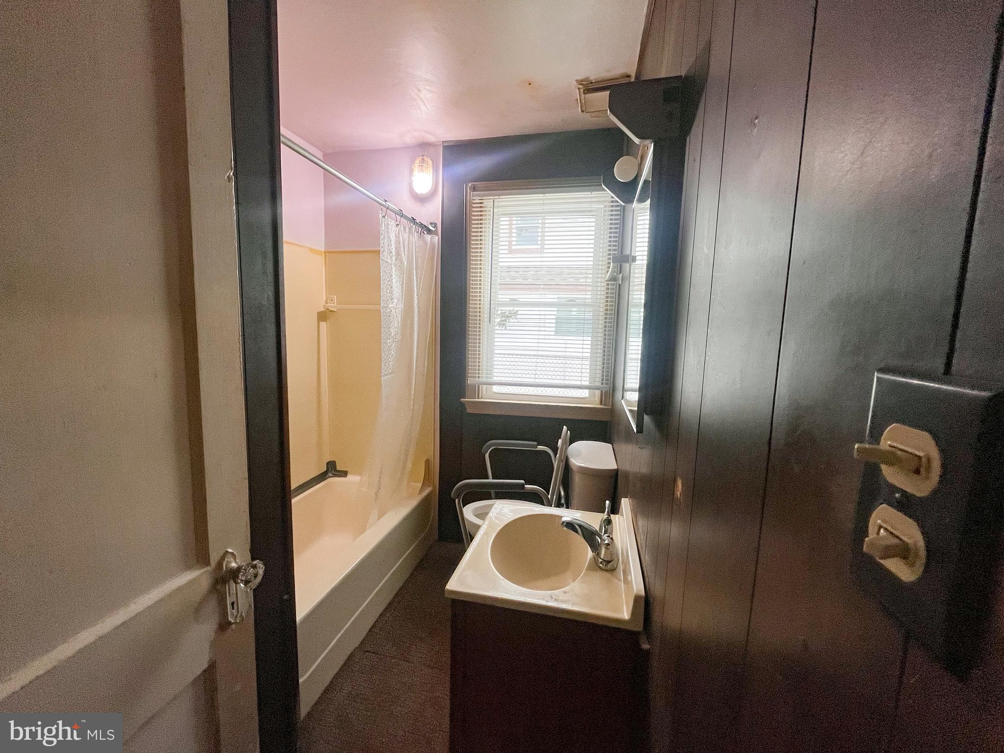 105 Harding Avenue Wilmington, DE 19804 - Photo 7 of 16 a bathroom with double vanity sink and mirror