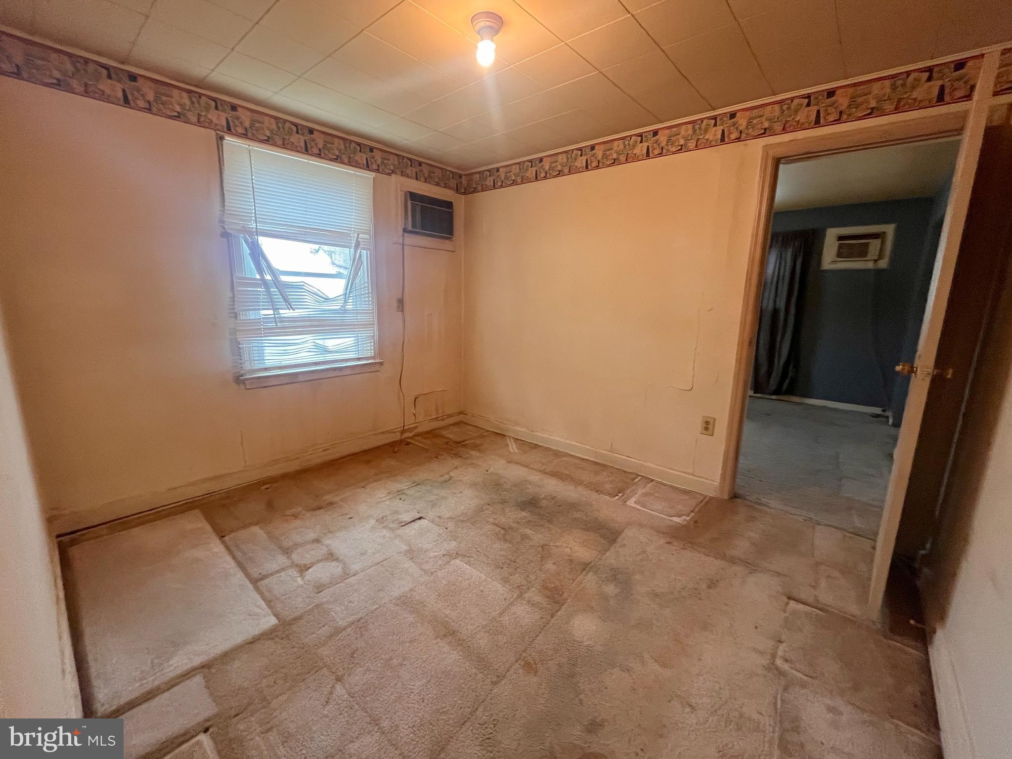 105 Harding Avenue Wilmington, DE 19804 - Photo 8 of 16 a view of an empty room with a window