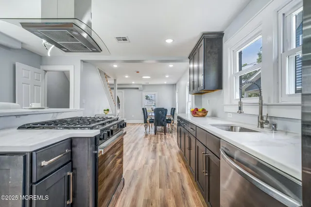 a kitchen with a stove and a sink