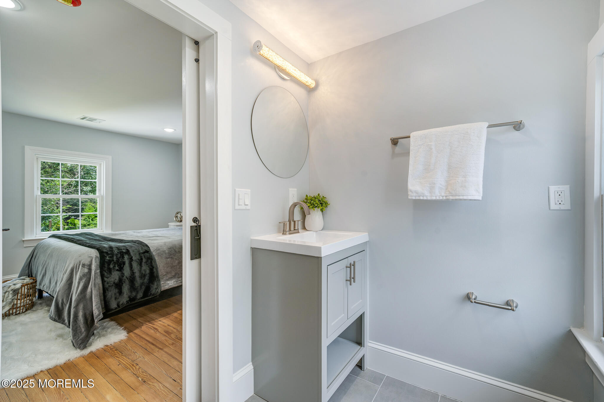 101 Broad Street Matawan, NJ 07747 - Photo 17 of 44 a bedroom with a bed and a mirror