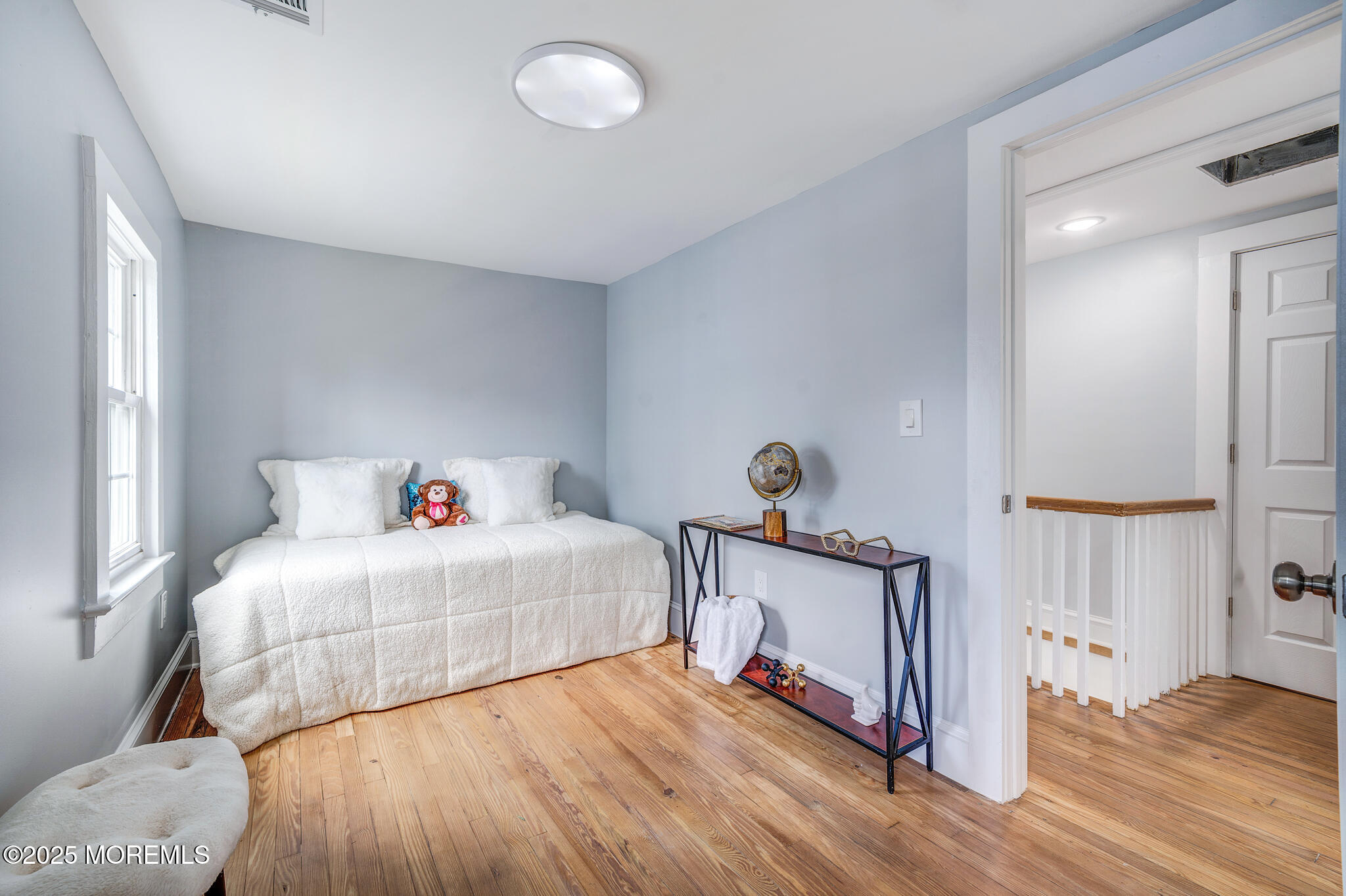 101 Broad Street Matawan, NJ 07747 - Photo 18 of 44 a bedroom with a bed and a window