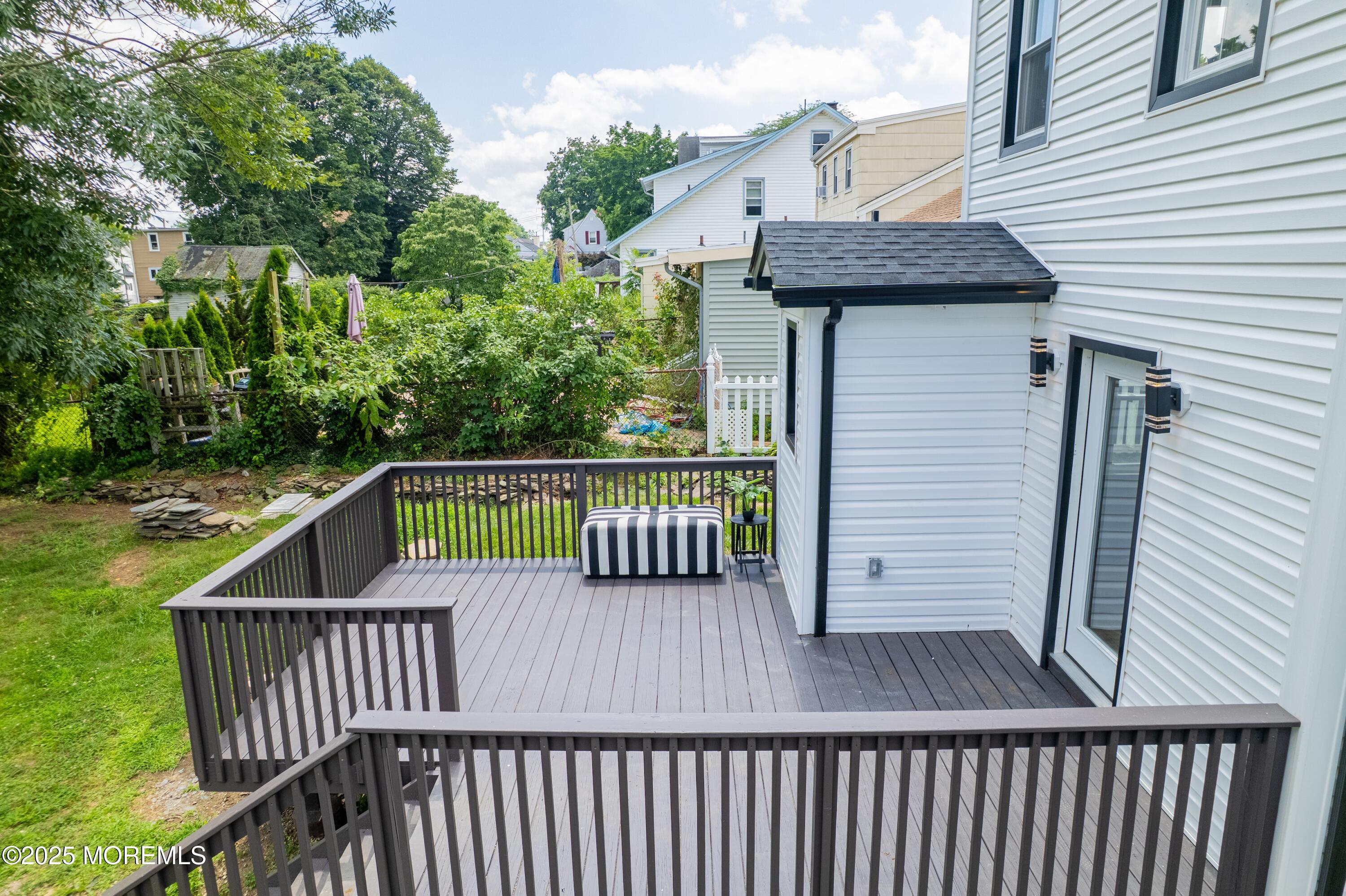 101 Broad Street Matawan, NJ 07747 - Photo 2 of 44 a view of a roof deck with wooden fence and plants